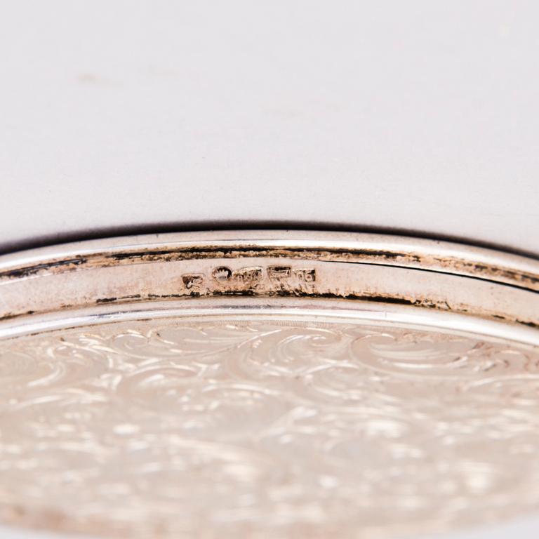 Two silver evening bags and a silver mirror, 1920s-1940s.