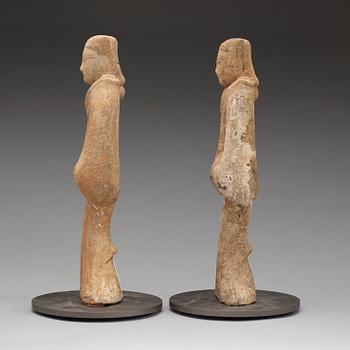 A pair of potted tomb figures of a guardiens, Han dynasty (206 B.C. - 220 A.D.).