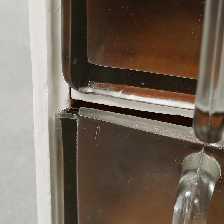 A spice rack from around the middle of the 20th century.