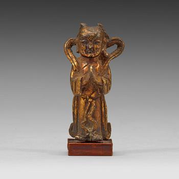 54. A gilt bronze figure of a standing boy, Ming dynasty, 15th/16th century.