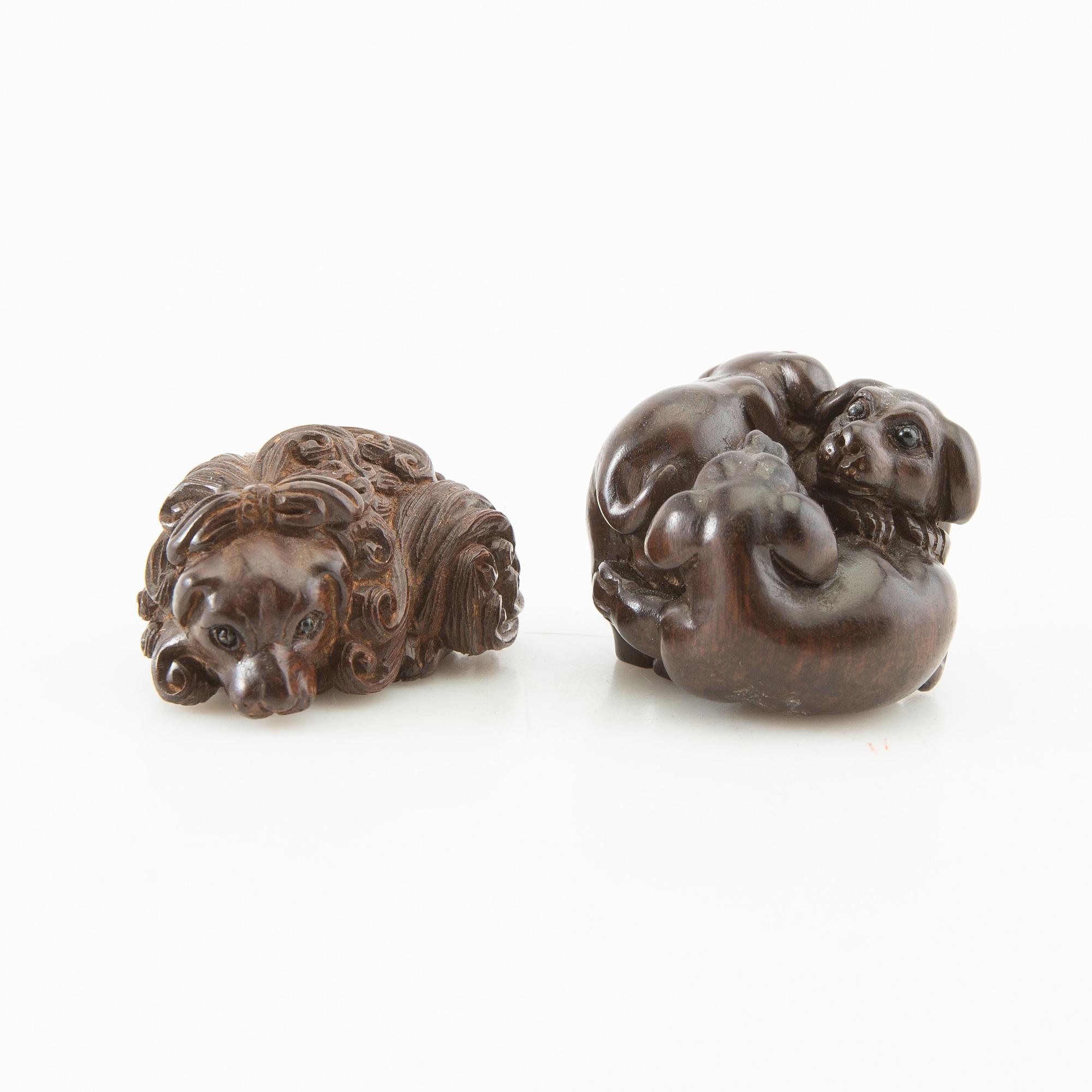 Netsuke, two pieces, hardwood. Japan, 20th century.
