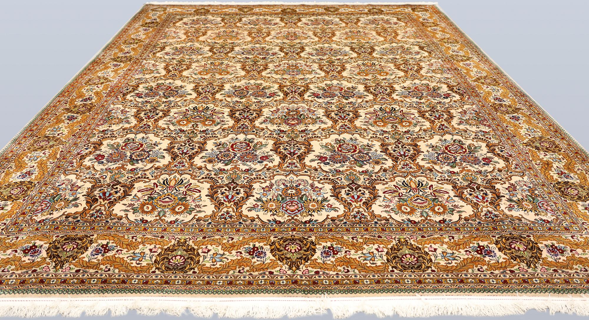 A part silk Ghom carpet, c. 420 x 310 cm.