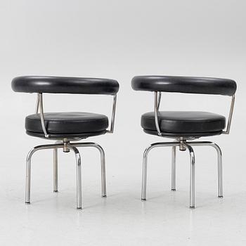 Charlotte Perriand, /Le Corbusier, swivel armchairs, a pair, model LC7, Cassina, Italy, later part of the 20th century.