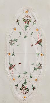 A collection of smaller Christmas tablecloths, runners, and wall hangings, approximately 34 pieces, mid/second half of the 20th century.