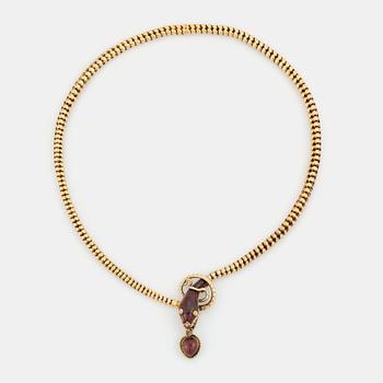 532. An 18K gold snake necklace with garnets.