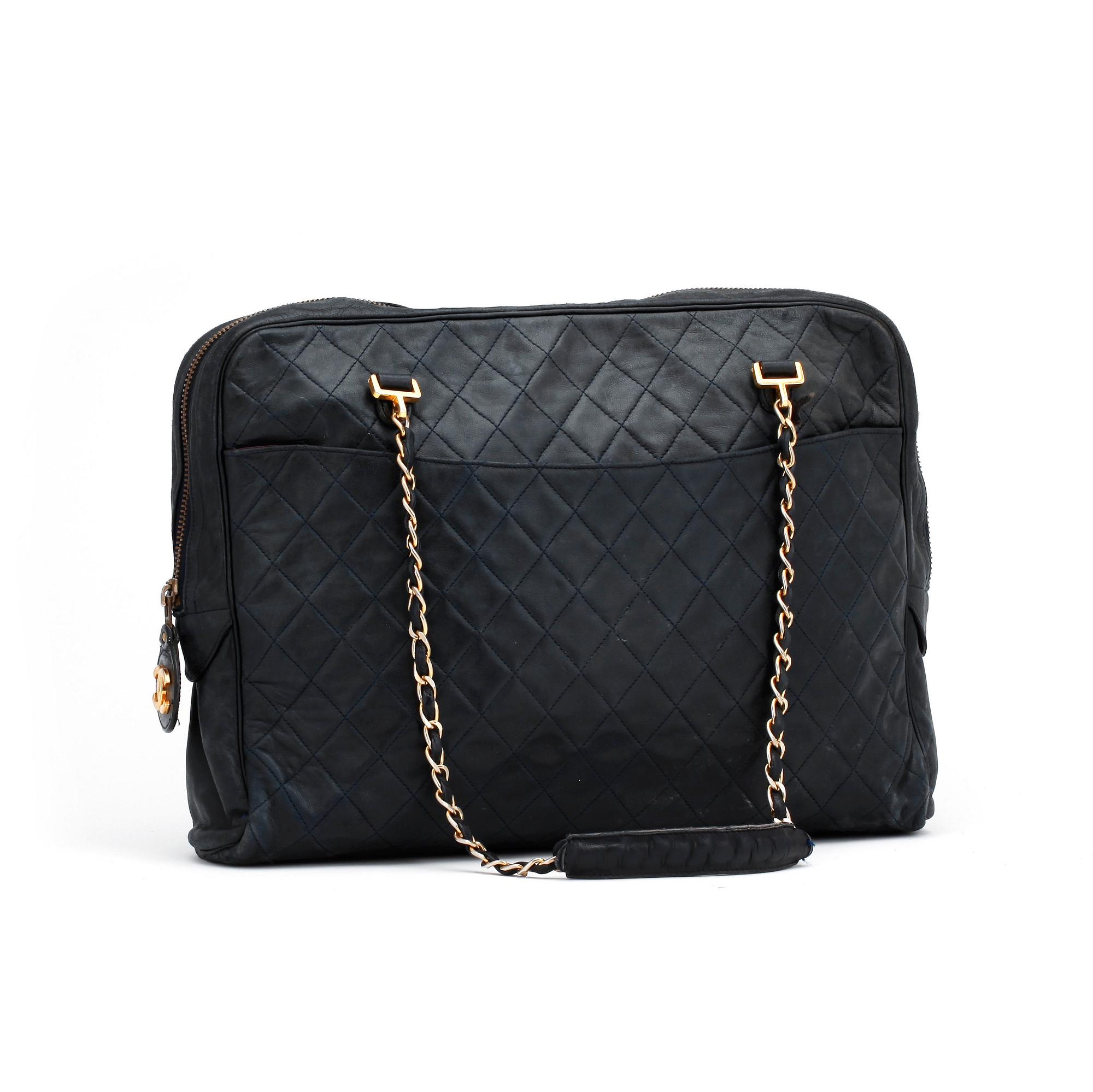 CHANEL, a darkblue leather shoulder bag, 1980s.