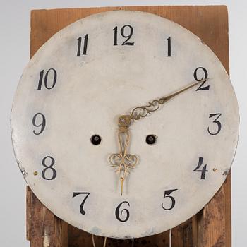 a painted grandfather-clock from the first half of the 19th century.