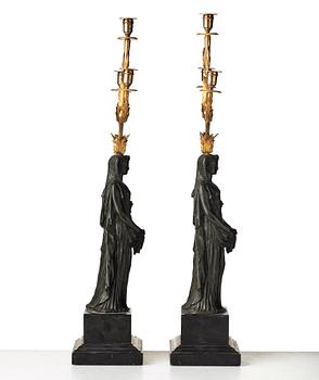 A pair of French Empire early 19th century three-light candelabra.