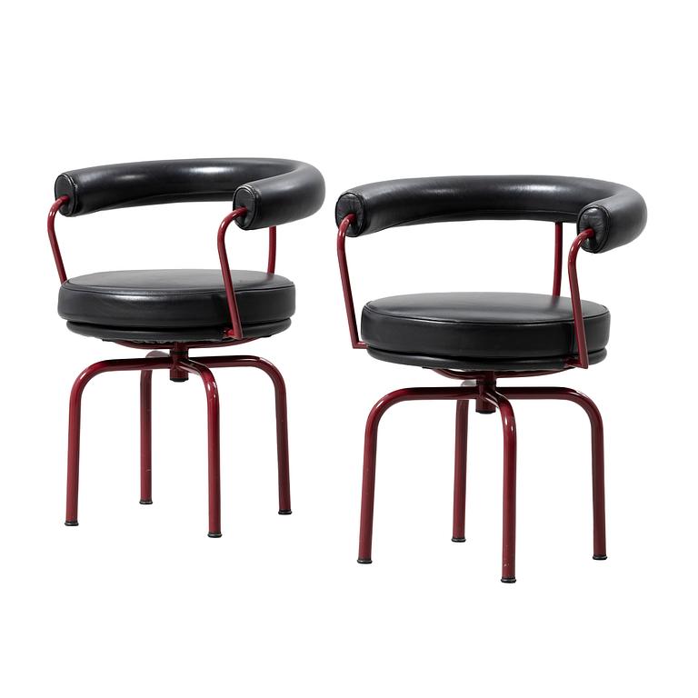 Charlotte Perriand, /Le Corbusier, swivel armchairs, a pair, model LC7, Cassina, Italy, latter half of the 20th century.