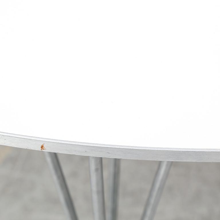 A 'Supercircle' table by Bruno Mathsson & Piet Hein for Fritz Hansen.