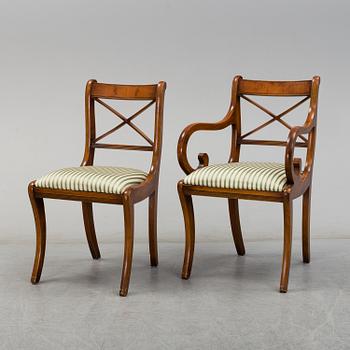 A late 20th century English style dining table and six chairs.
