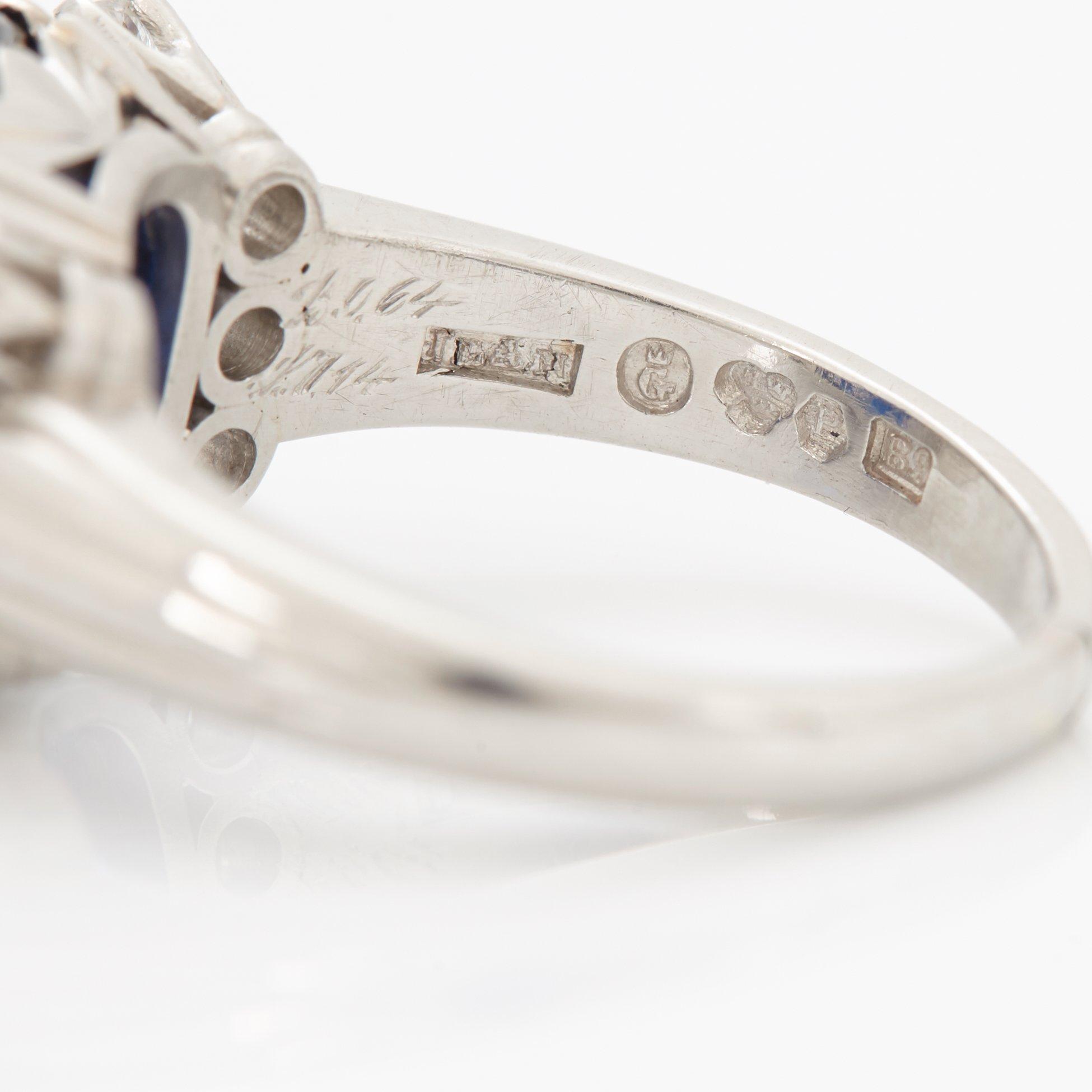 A RING set with a faceted sapphire.