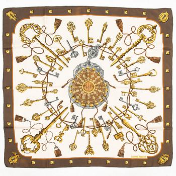 Hermès, Two silk scarves, 'Les Voitures a Transformation' and 'Les Clefs'.