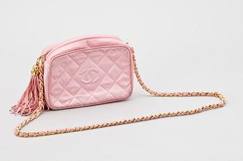 A pink silk shoulder bag by Chanel.