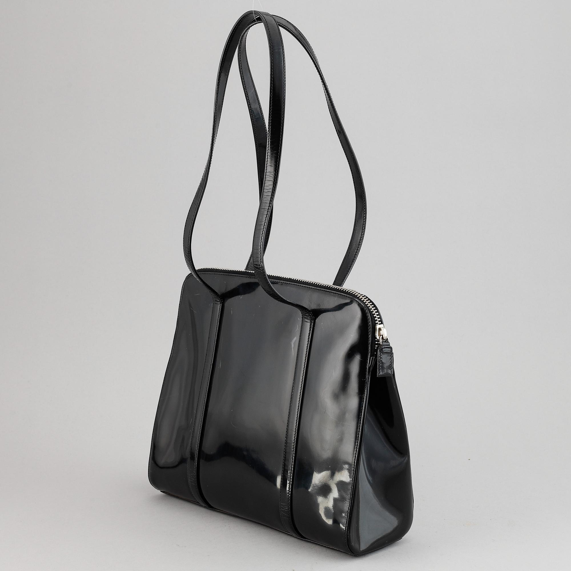 Prada, a patent leather bag.