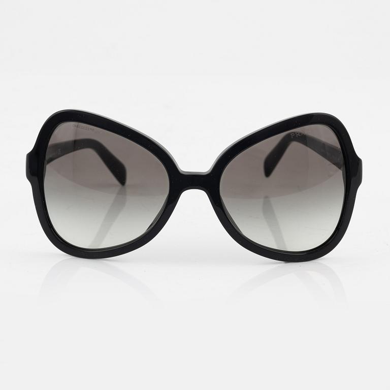 Prada, a pair of black sunglasses.