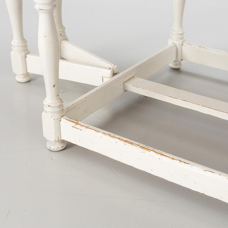 An early 20th century drop-leaf table.