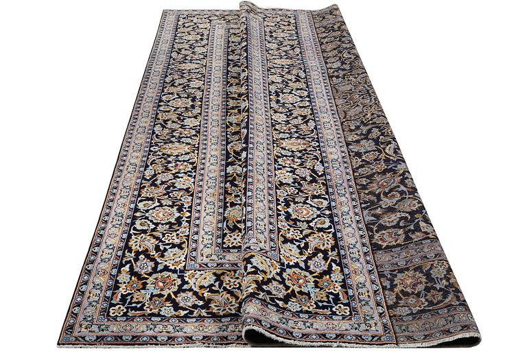 A Kashan carpet, signed, c. 381 x 285 cm.