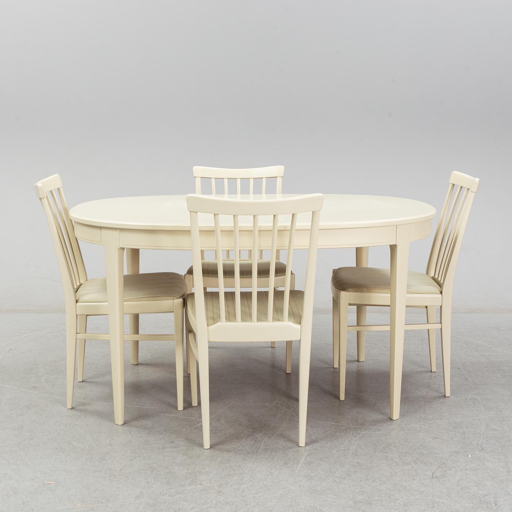 A dining table with six chairs by Carl Malmsten. Second half of the 20th Century.