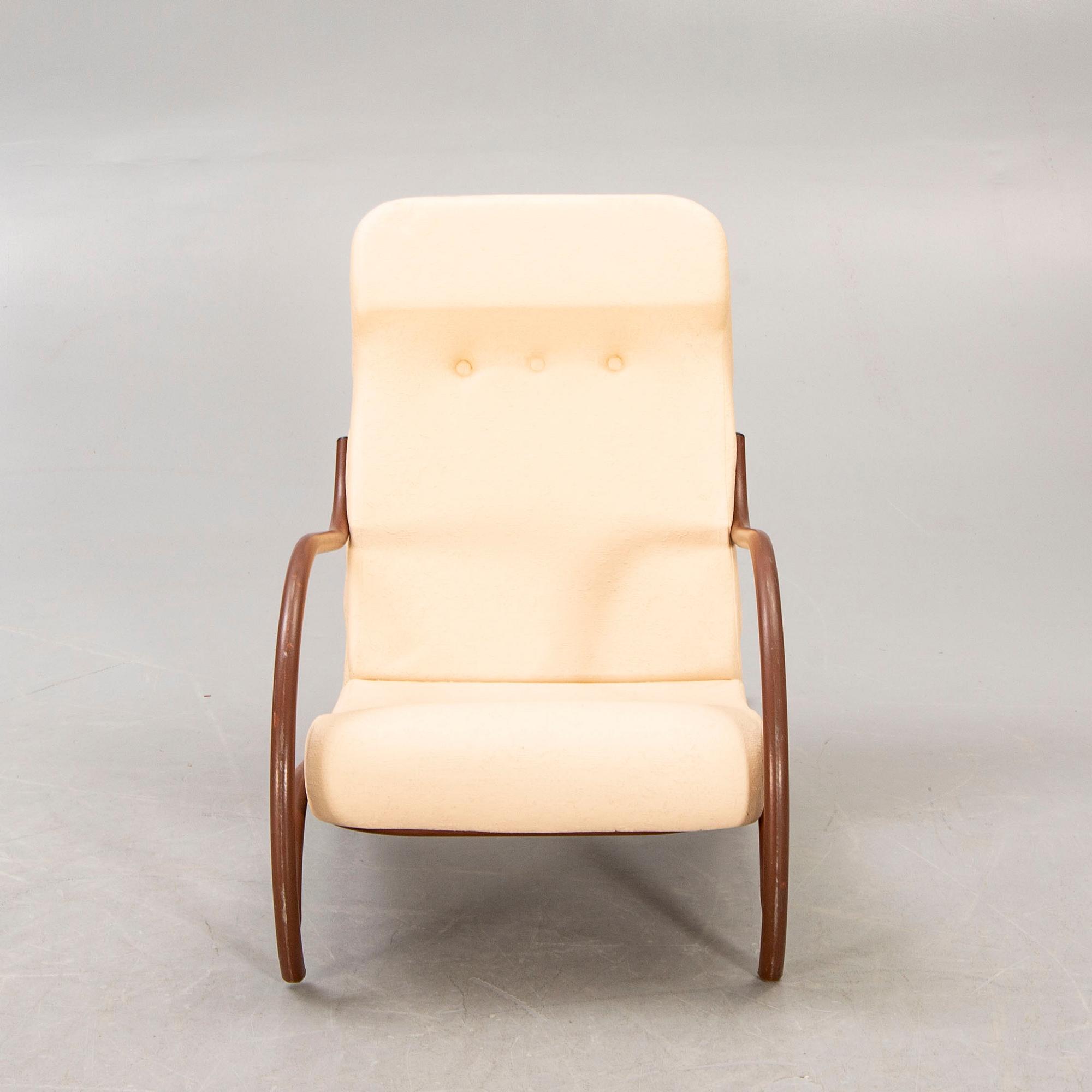 A 1930/40s metal and textile/plastic easy chair.