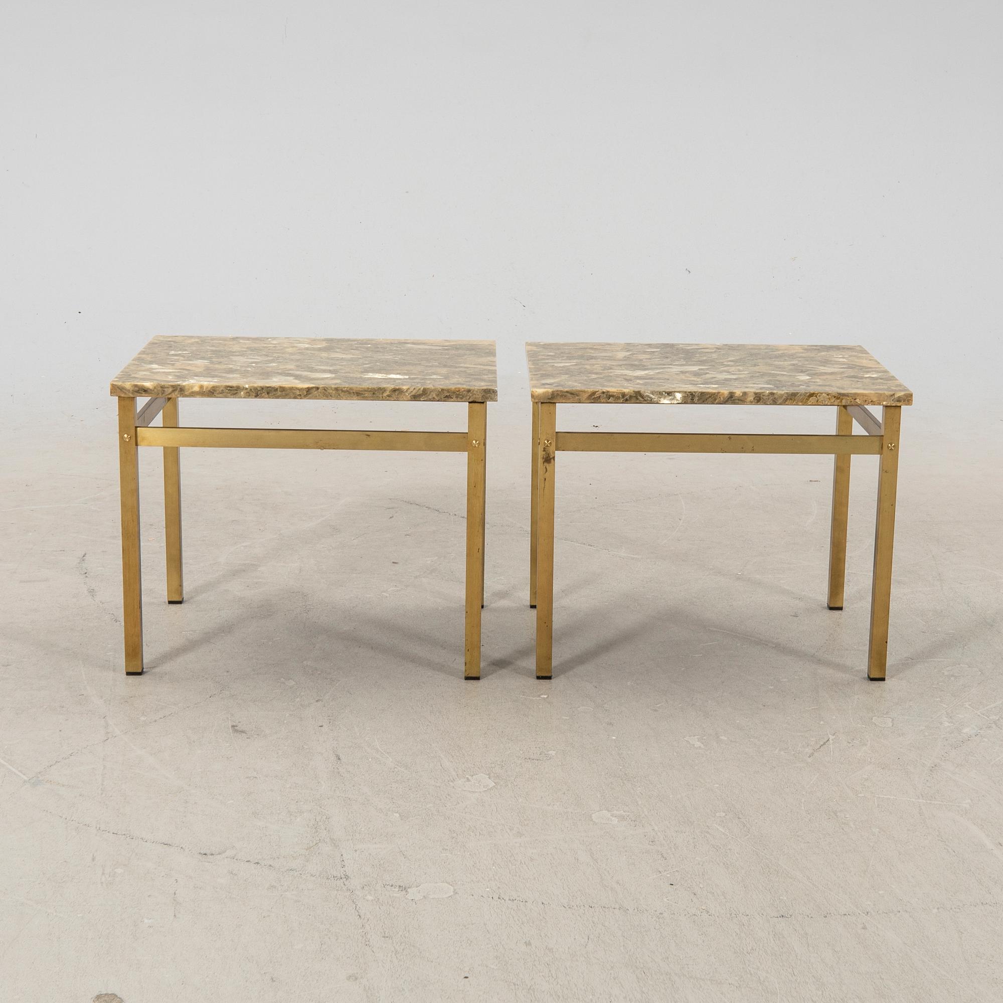 A pair of metal and stone side tables from the second half of the 20th century.