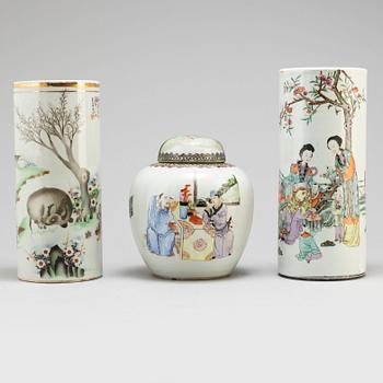 Two Chinese famille rose hat stands and a jar with cover, 20th century.