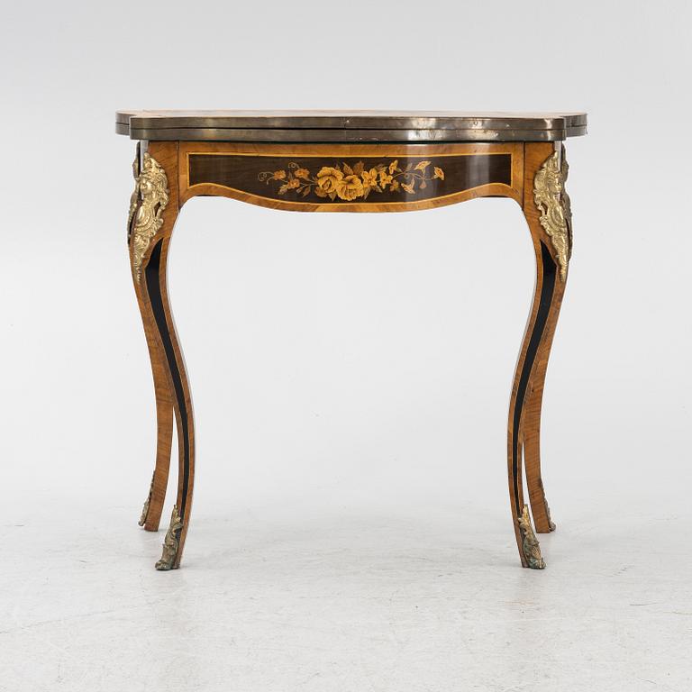 A Louis XV-style games table, early 20th century.