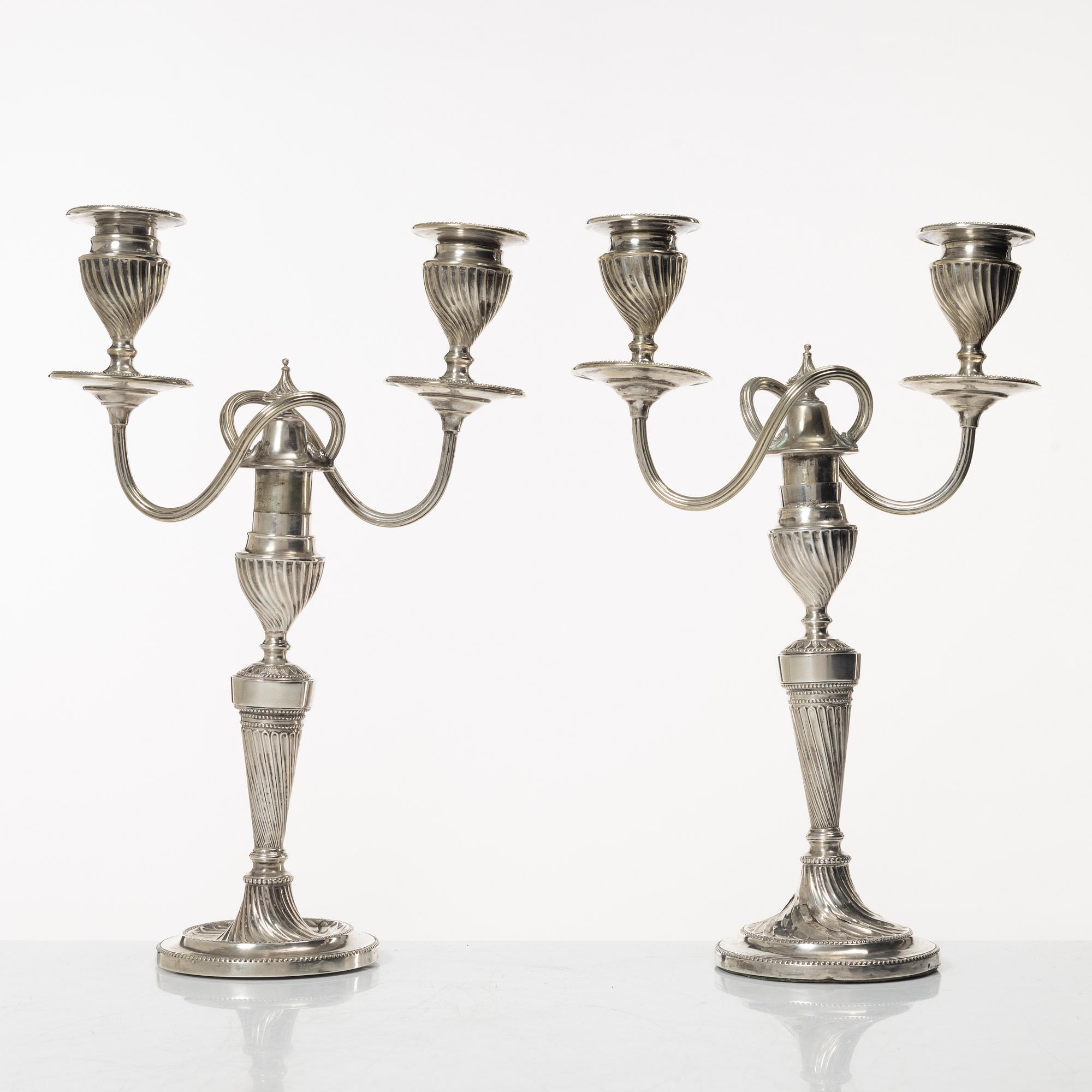 A pair of English silver candelabra, mark of Hawksworth, Eyre & Co Ltd, Sheffield 1892.