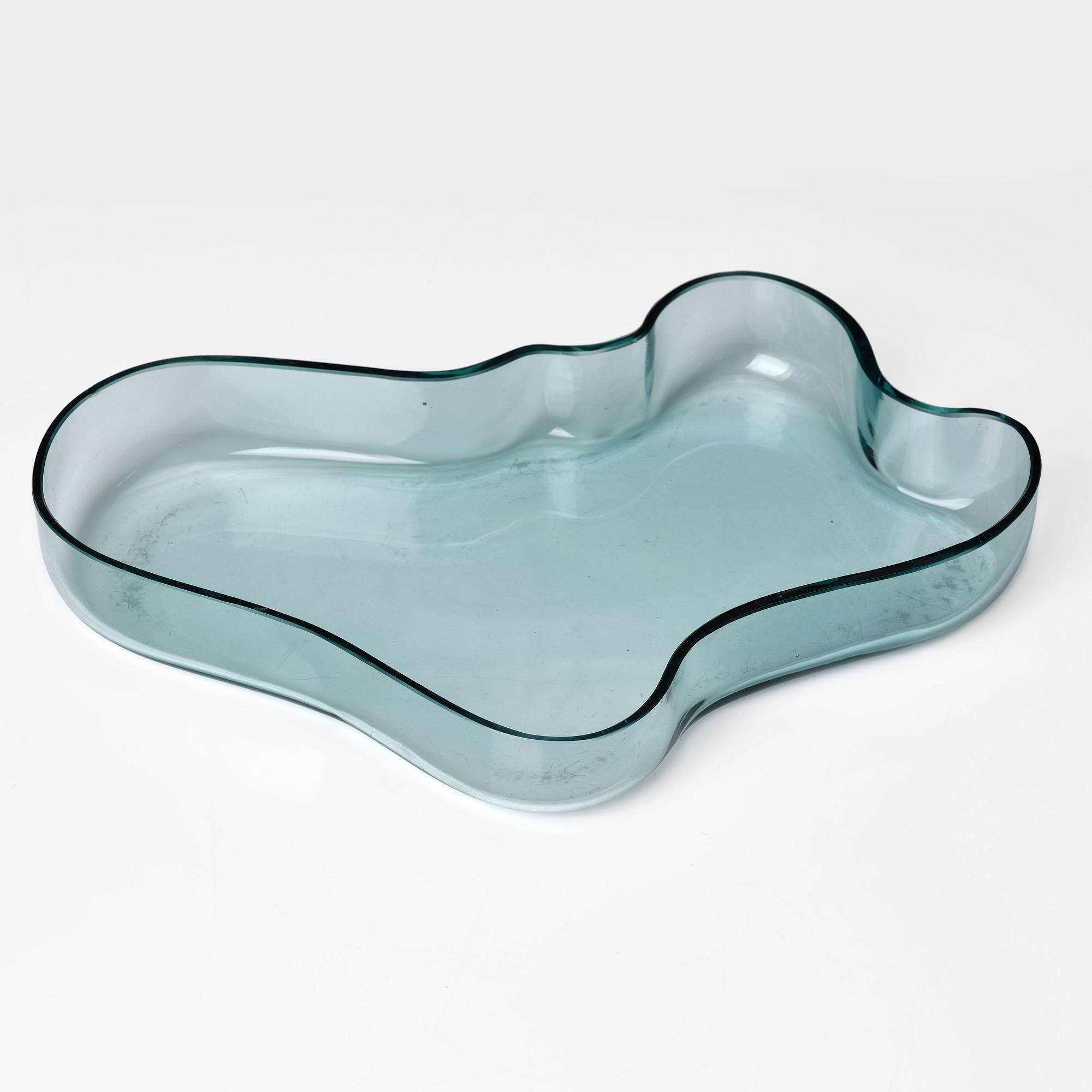 Alvar Aalto, a green tinted glass dish, model 9748 for Karhula Glassworks, Finland, in production 1937-1949.