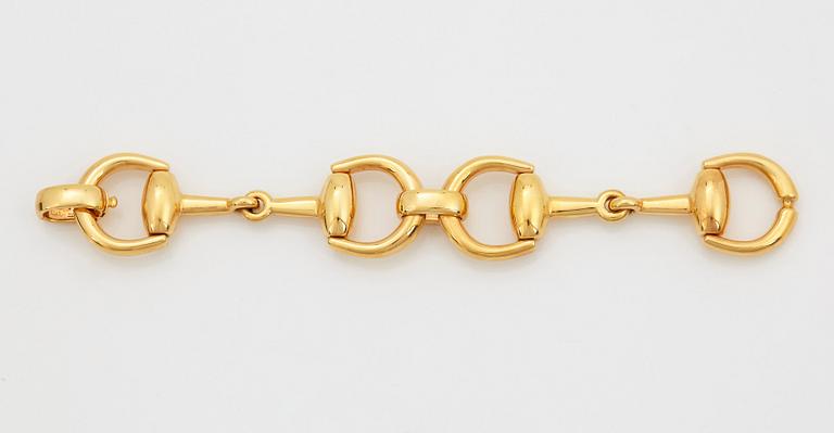 An 18K gold Gucci bracelet.
