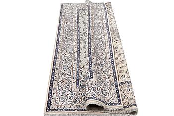 A Nain carpet, part silk, c. 294 x 193 cm.