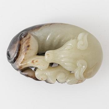 A Chinese nephrite sculpture of a reclining dog, 20th Century.