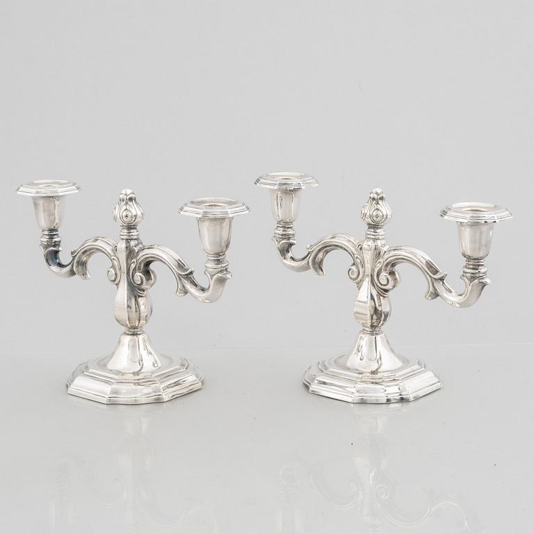 A pair of Swedish silver candelabras, marks of CG Hallberg, Stockholm 1959.