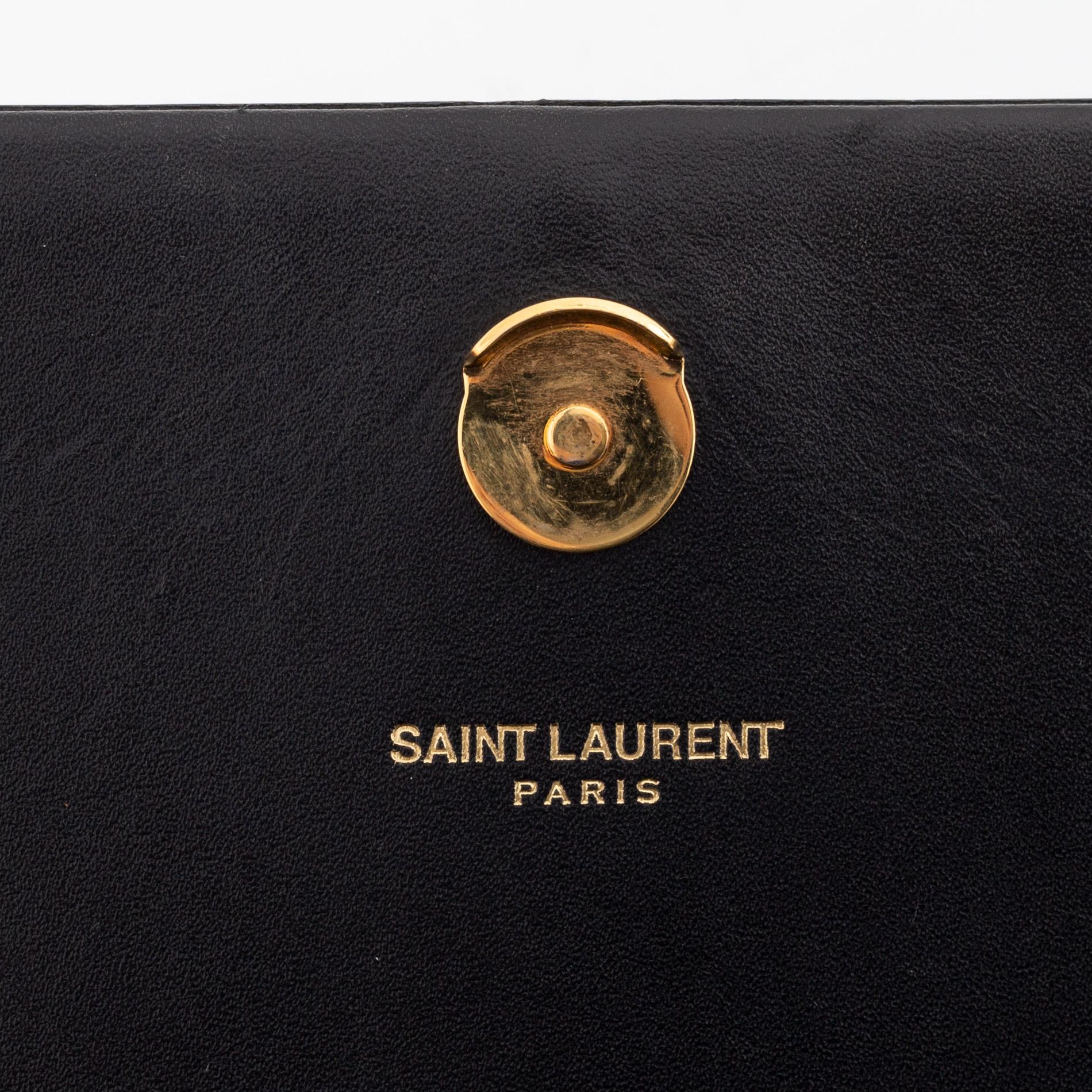 Yves Saint Laurent, a black leather 'Kate Medium' clutch,.
