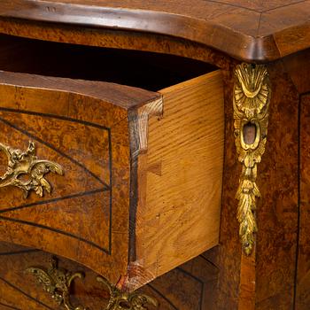 A mid 20th century rococo style chest of three drawers.