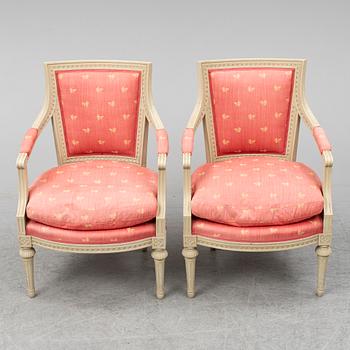 A pair of gustavian style armchairs, second half of the 20th century.