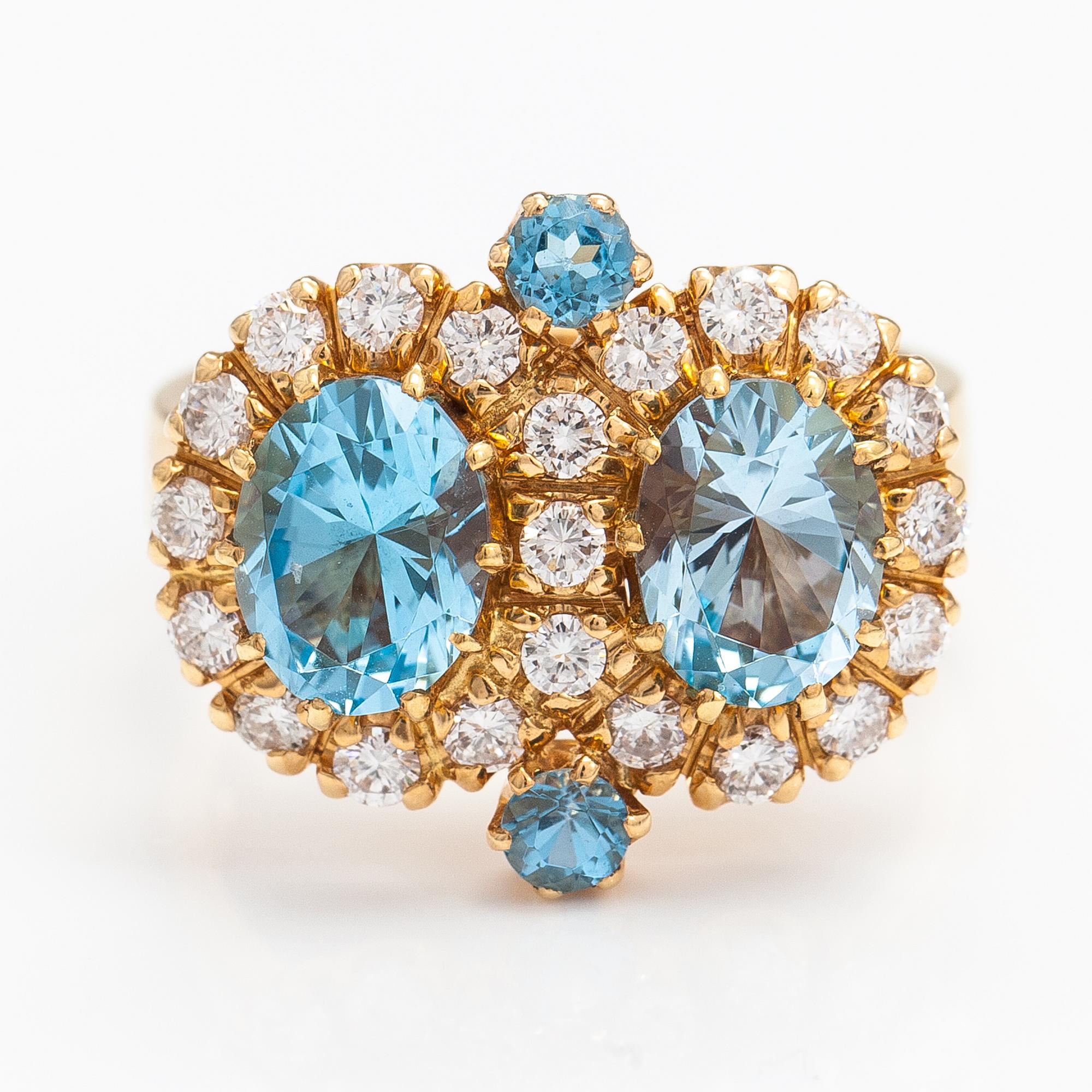 An 18K gold ring "Sophia Albertina" with topazes and diamonds ca. 0.72 ct in total. Ofelia Jewelry, Helsinki 1998.