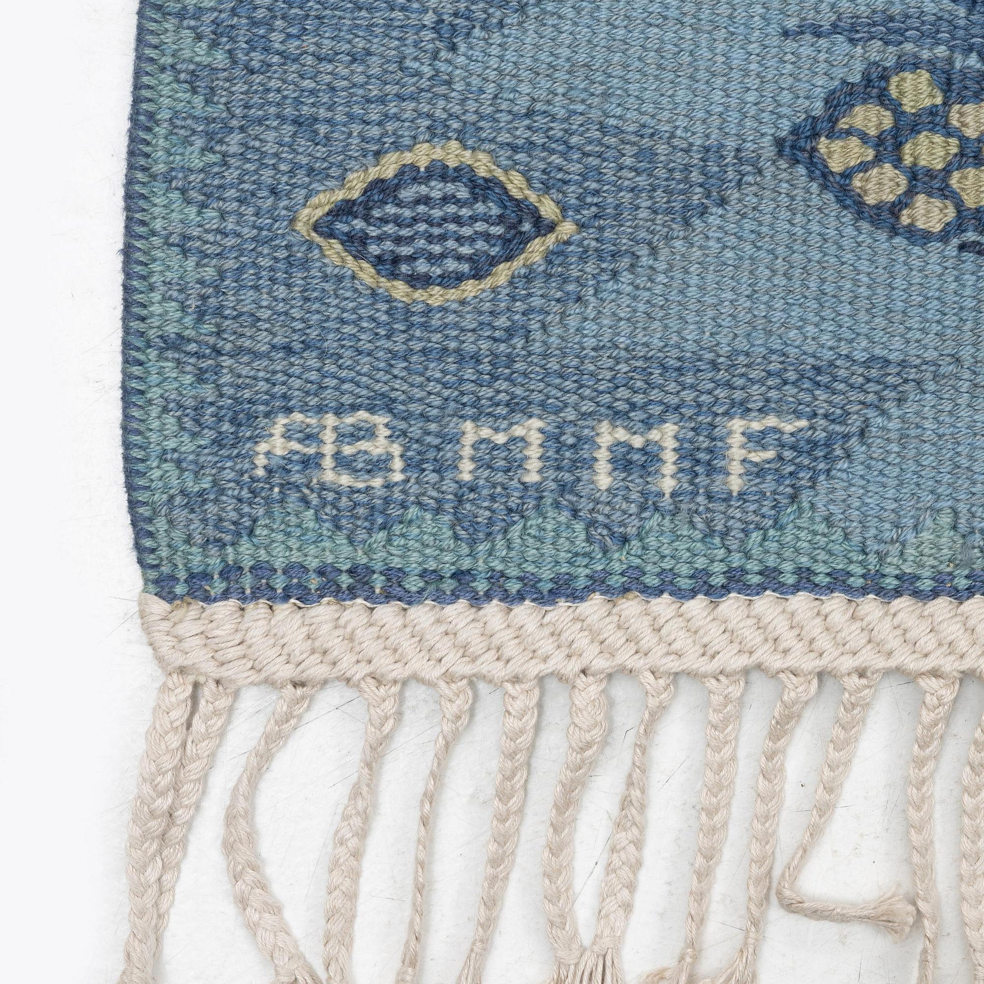 Barbro Nilsson, a carpet, 'Tånga mellanblå', flat weave, c. 350 x 252 cm, signed AB MMF BN.