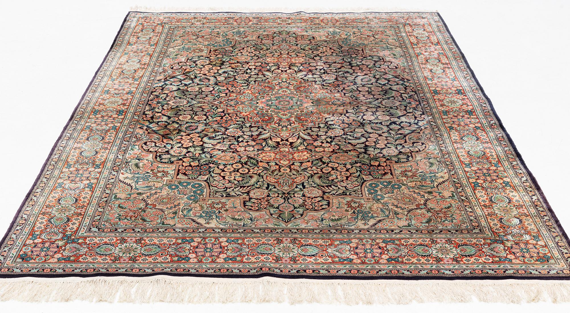 An oriental carpet, mercerized cotton, c. 275 x 182 cm.