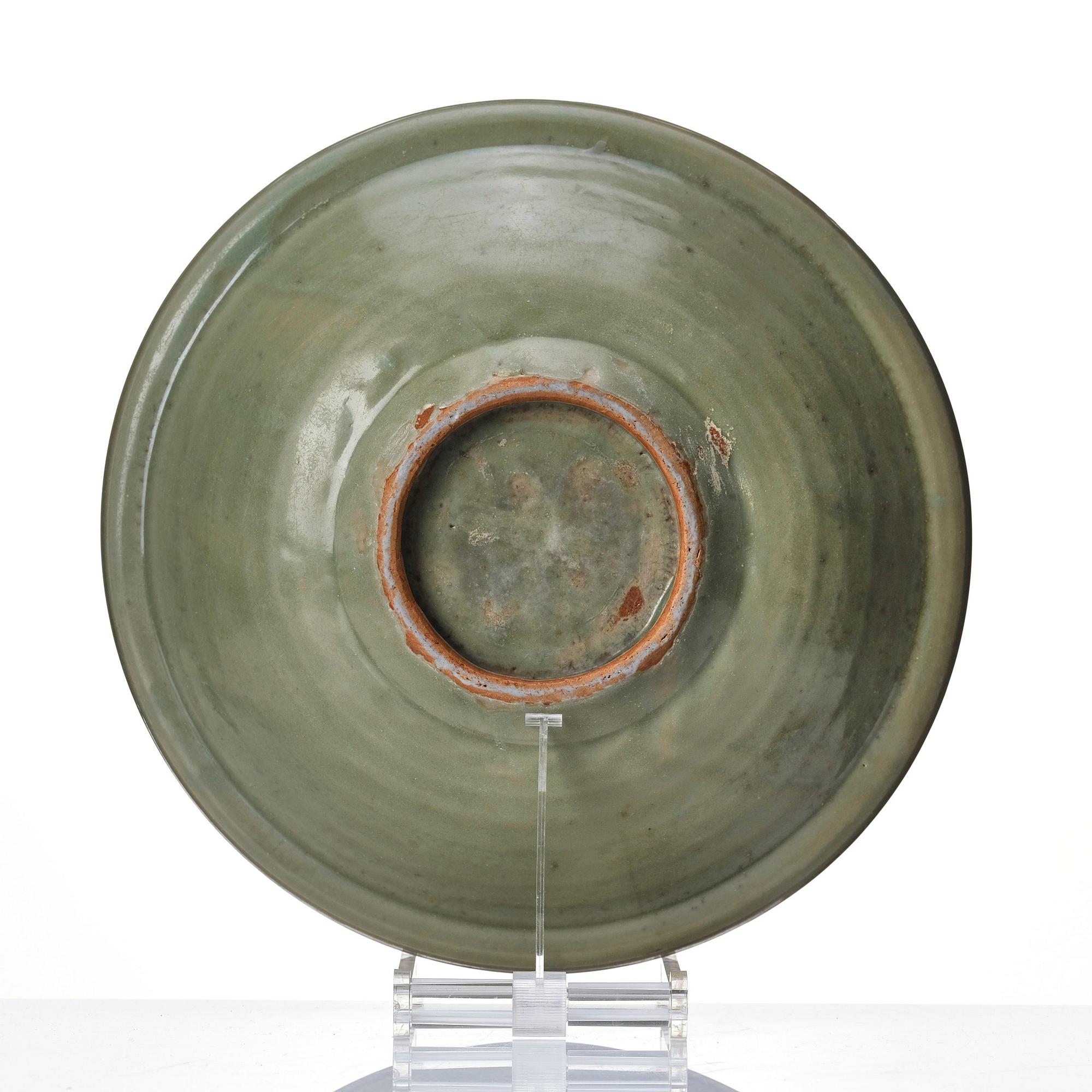 A large celadon glazed dish, Ming dynasty (1368-1644).