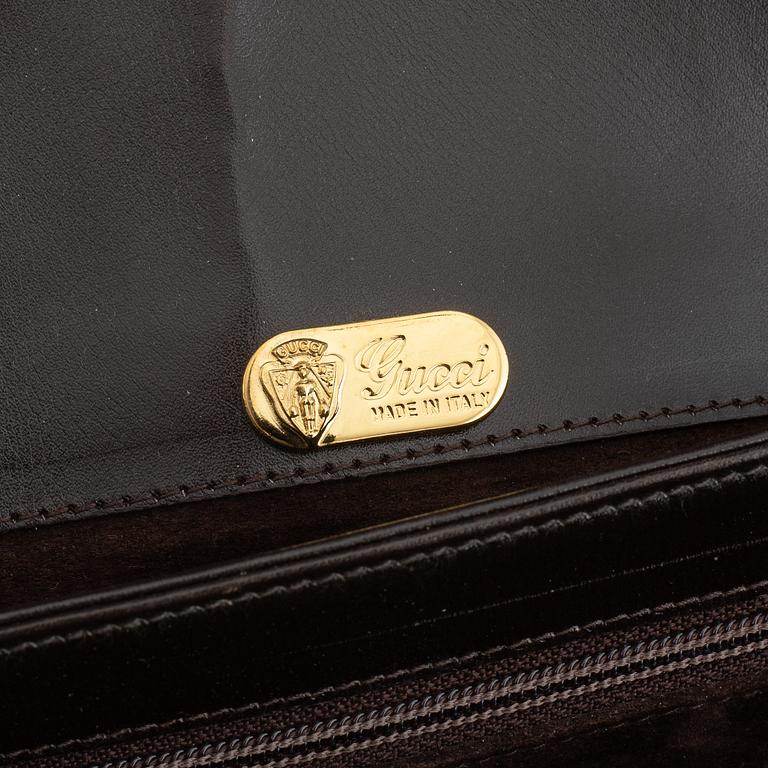 Gucci, a leather and bamboo bag.
