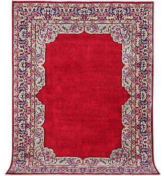 An old Kerman carpet, signed, c. 290 x 208 cm.