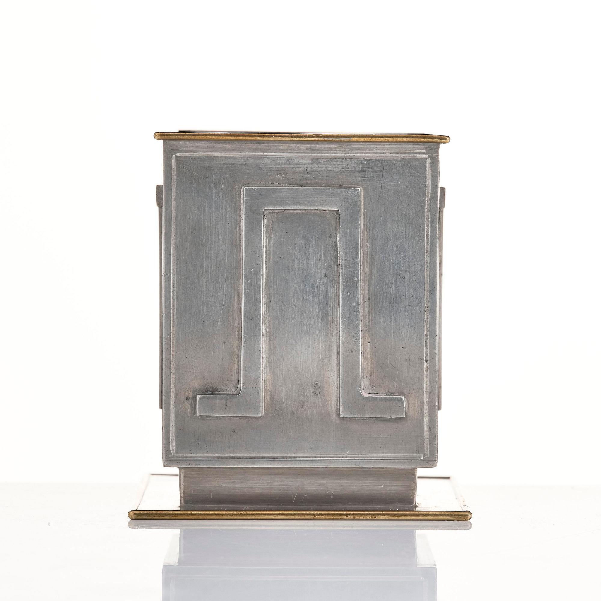 Nils Fougstedt, pennkopp, tenn och mässing, modell A 503, Firma Svenskt Tenn, Stockholm, 1932.