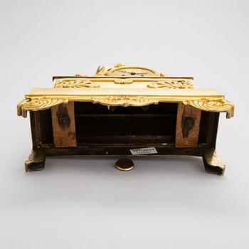 A French Empire mantel clock from 1820s-30s.