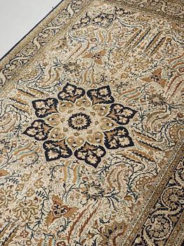 A silk Qum carpet, around  219 x 137 cm.