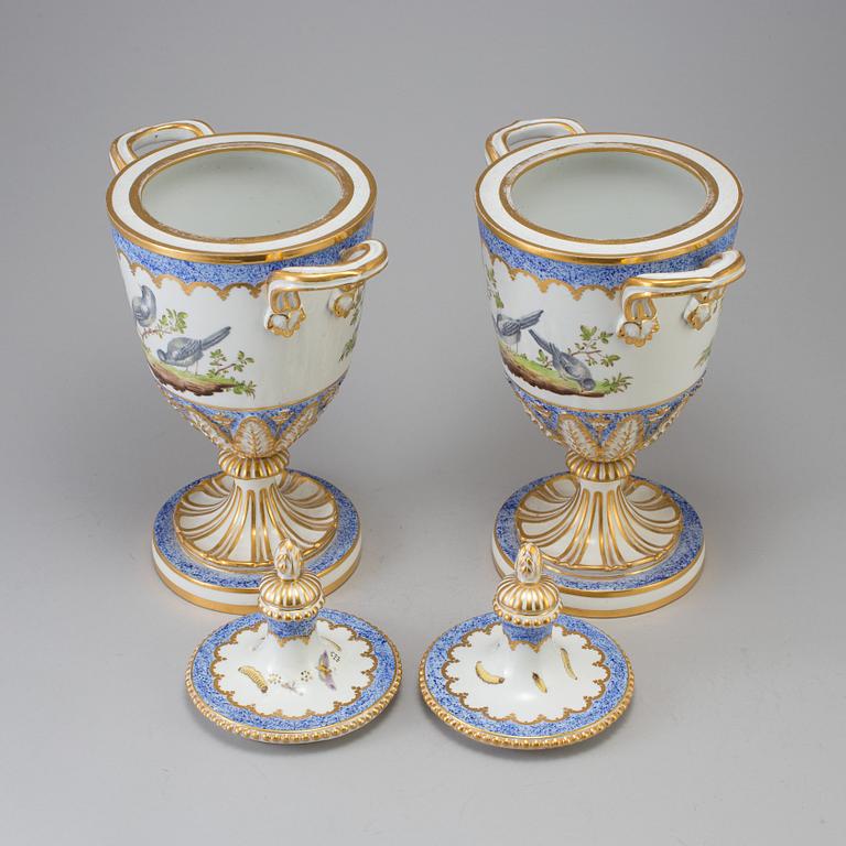 A pair of French 19th century porcelaine 
lidded vases with Sèvres style mark.