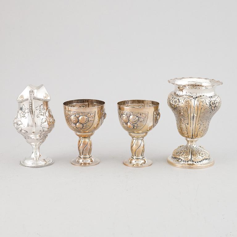 A mixed lot of two beakers, a vase and a jug, Baroque style, silver 830, 20th century.