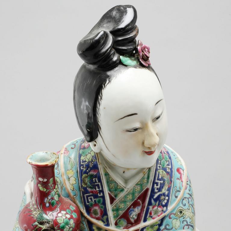 A porcelain figurine from China, late 19th or early 20th century.