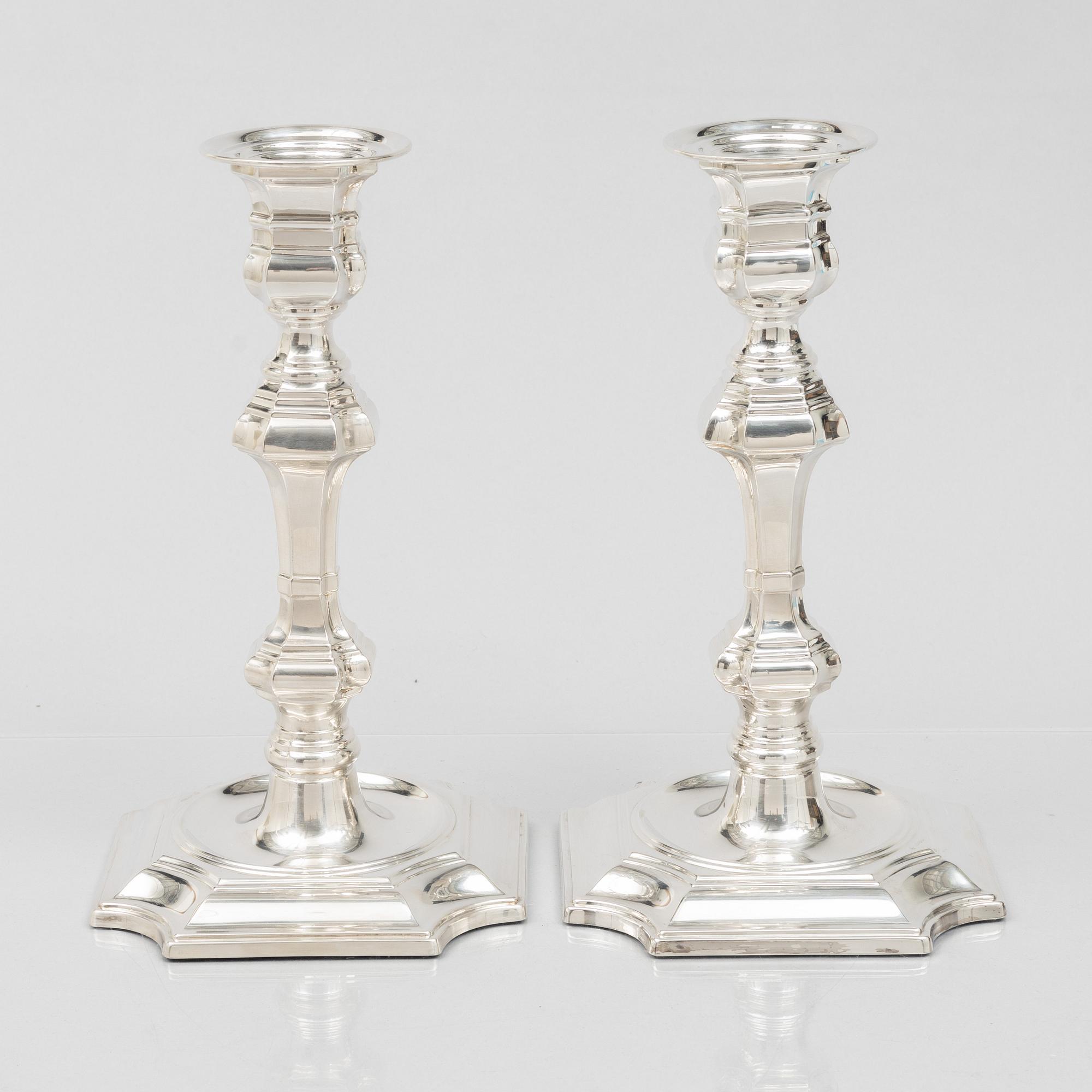 Pedro Duran, a pair of Baroque style sterling silver candle sticks, Spain.