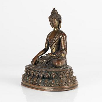 A cold gilt copper alloy figure of buddha Shakyamuni, Tibet, early 20th Century.